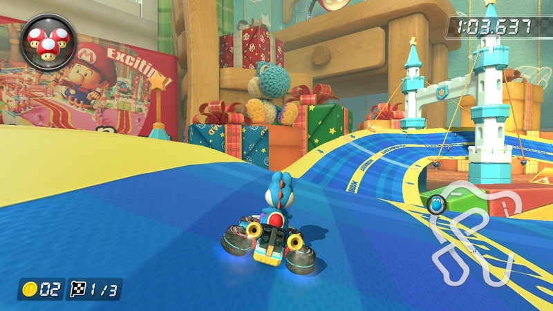 Archivo:Decoración basada en el amiibo de Yoshi de lana azul claro en Mario Kart 8 Deluxe.jpg