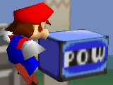 Mario junto a un bloque POW en Super Smash Bros.