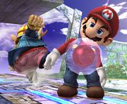 Mario aturdido en Super Smash Bros. Brawl. Se le ha adherido una Bomba Gooey.