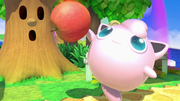 Jigglypuff junto a una manzana en Super Smash Bros. Ultimate.