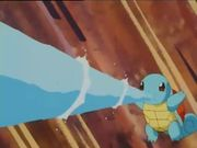 Squirtle de Ash usando pistola agua.