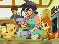 Archivo:EP535 Reggie atendiendo a los Pokémon.png