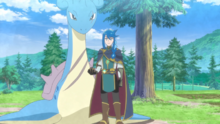 Lucius junto a Lapras.