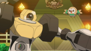 Rowlet junto a Melmetal.