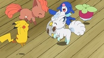 Vulpix jugando con otros Pokémon.