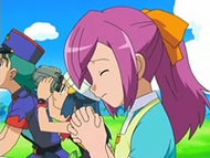 Melodi comunicándose con Gardevoir para que teletransportara a todos fuera de la nave que caía.
