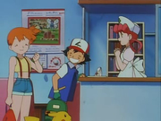 Ash, Misty y la enfermera Joy charlan, mientras que se puede observar, en el fondo de la escena, un cartel donde se ve un Dugtrio.