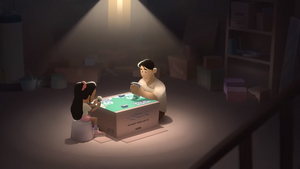 Ava jugando a cartas junto a su padre.