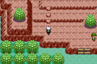 Personaje frente a una rampa de rocas en Pokémon Esmeralda.