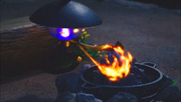 Lampent del Resort Pokémon/Complejo hotelero Pokémon usando ascuas.