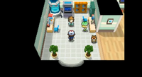 Entrenador en el laboratorio de la profesora Encina para recibir su Pokémon inicial en Pokémon Negro y Blanco.