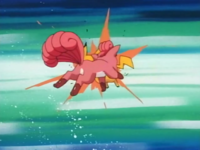 Vulpix de Brock y Pikachu de Ash usando ataque rápido.