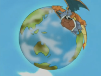 Charizard de Ash usando movimiento sísmico.