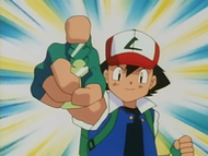 Ash con la medalla Tierra.
