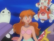 Shellder junto a Misty y los demás Pokémon del gimnasio Celeste.