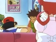 Ash, Brock y la enfermera Joy charlan, mientras que se puede observar, en el fondo de la escena, un cuadro donde se ve un Farfetch'd.