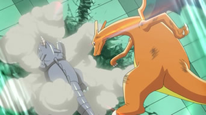 Charizard usando movimiento sísmico.