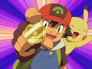 Ash con el símbolo de Coraje.
