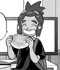Tilo comiendo una malasada en el manga Pocket Monsters Special.