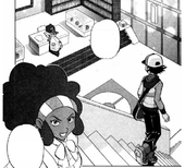 Black/Negro entra al campo de batalla del Gimnasio Pokémon de Ciudad Esmalte.
