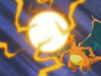 Charizard de Ash usando furia dragón.