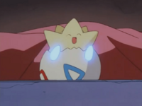 Togepi usando metrónomo.