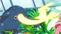 Heracross de Goh usando ataque furia.