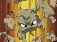 Geodude de Roxanne/Geodude de Petra usando lanzarrocas.