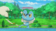 Froakie lanzando espuma a Goh.