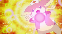 Audino de una enfermera Joy usando pulso cura/pulso sanador. Genera una esfera rosa...