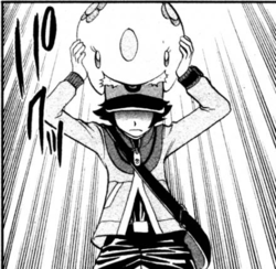 Musha usando comesueños para sacarle el pensamiento a Black/Negro de ganar la Liga Pokémon.