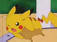 Pikachu usando placaje para romper la jaula.