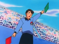 Árbitro Pokémon/Juez Pokémon de la Liga Pokémon de la Meseta Añil.