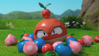 Voltorb de Hisui con una baya Zanama tapándole el agujero de la cabeza.