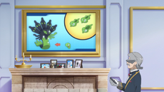 Hámber/Ambros usando una de las pantallas de la mansión en su explicación.